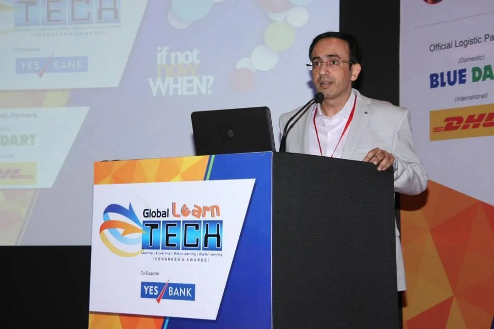 Naveen Shukla presenting at a conference